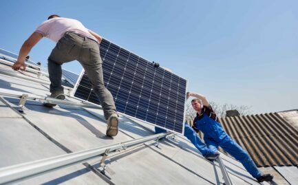 Installing solar photovoltaic panel system on roof of house- Big Texan Solar
