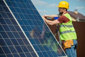 Solar installer installing solar panels- Big Texan Solar