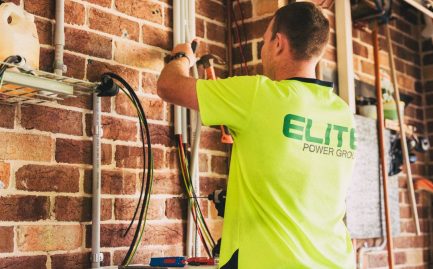 electrician installing solar battery storage in a Texas home