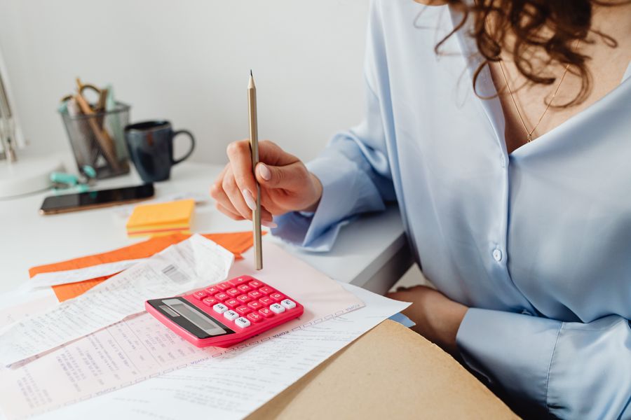 homeowner calculating solar lease payments against utility bills