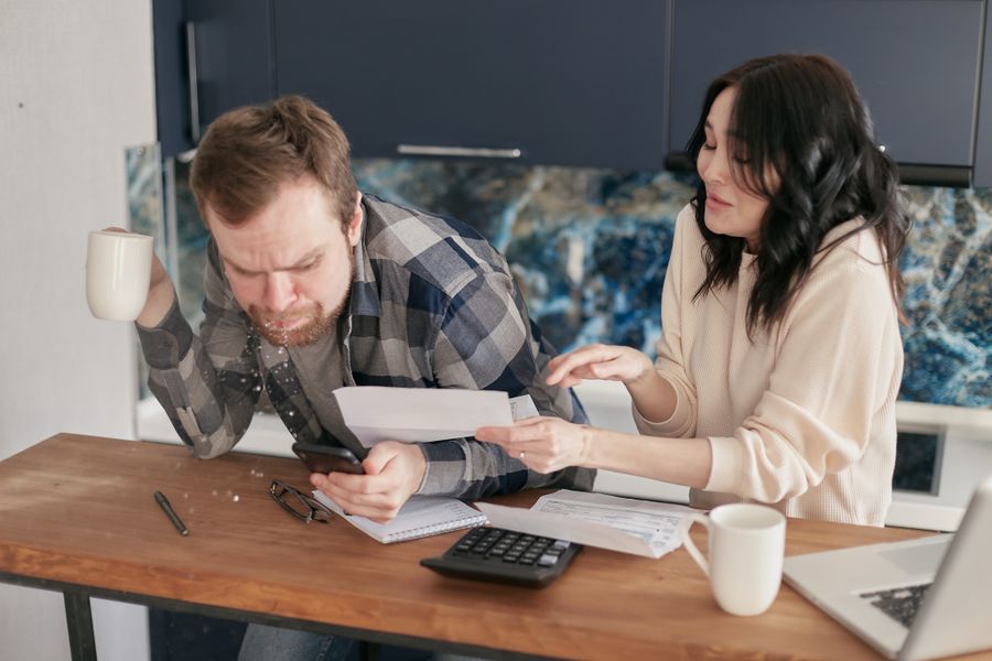 Texas couple reviewing a solar sales contract carefully at home