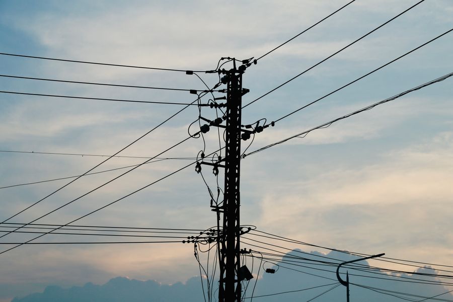 power lines at sunset in Texas symbolizing grid electricity exports